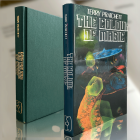 Faithful reproduction of the 1983 first edition with Alan Smith cover art—for discerning collectors chasing the origins of Discworld's tourist-sparked chaos.