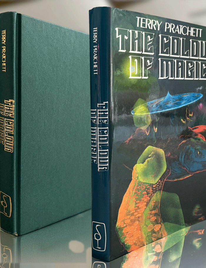 Faithful reproduction of the 1983 first edition with Alan Smith cover art—for discerning collectors chasing the origins of Discworld's tourist-sparked chaos.
