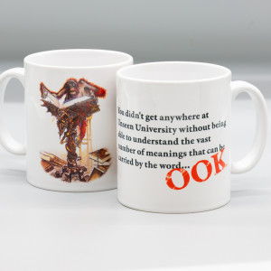 Bright white ceramic mug featuring the Librarian at the lecturn by Paul Kidby, Discworld Unseen University character with a quote and the slogan "OOK"
