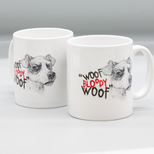Bright white ceramic mug featuring a pencil drawing of Scraps by Paul Kidby, Discworld character with the quote "WOOF BLOODY WOOF"