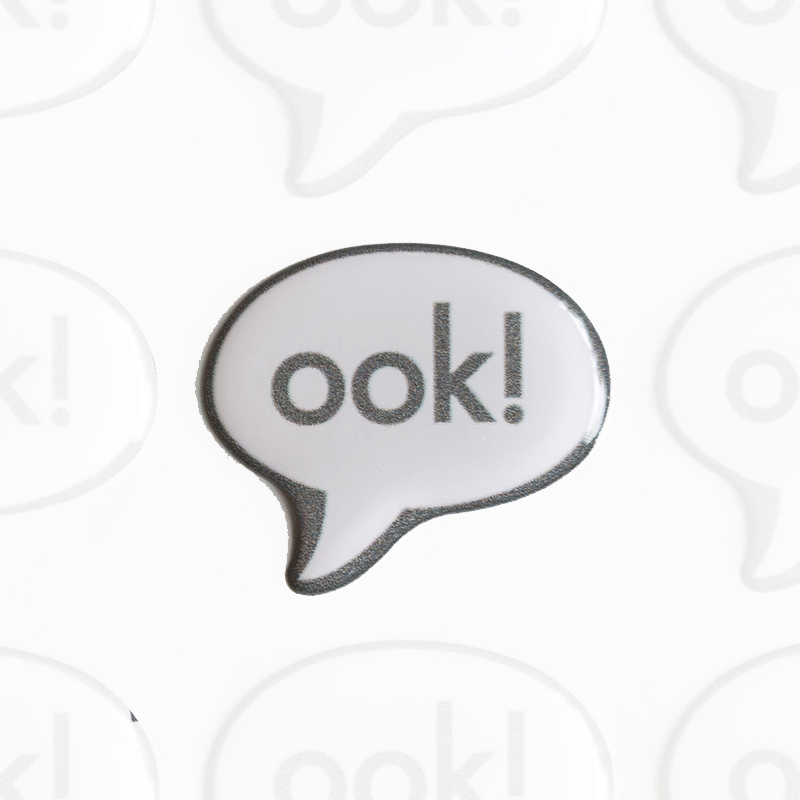 A self-adhesive domed sticker featuring the Librarian's "Ook!" as opposed to "Eek".... Ideal for sticking onto your computers, notebooks, mirrors and noses A sticker. A self-adhesive domed sticker featuring the Librarian's "Ook!" as opposed to "Eek".... Ideal for sticking onto your computers, notebooks, mirrors and noses A sticker.
